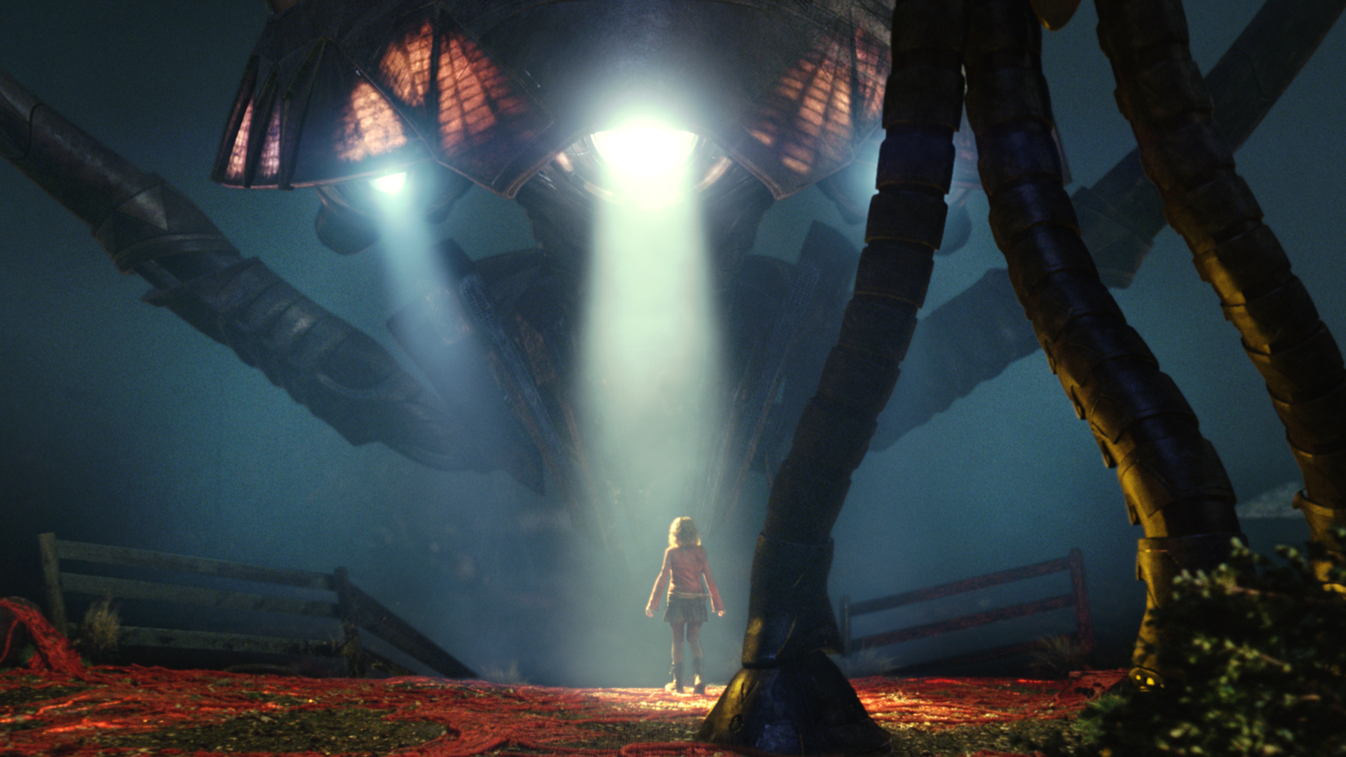 Rachel Ferrier (Dakota Fanning) stands alone beneath a massive alien tripod walker in the Academy Award®-nominated War of the Worlds (2005). © Paramount Pictures. All Rights Reserved.